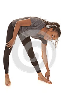 Woman in gray shirt fitness stretch bend down
