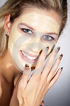 Woman with great makeup and face mask