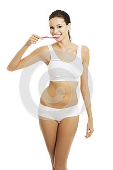 Woman with great teeth holding tooth brush