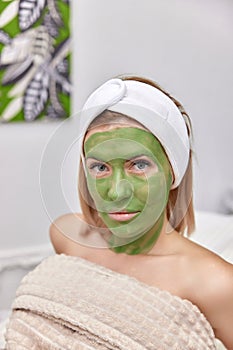 woman with green alginate mask on face