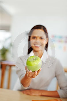 Woman, green apple and fruit for a healthy lifestyle, diet and eating for health and wellness while sitting at home with