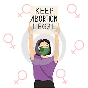 Woman in green bandana protesting against abortion law