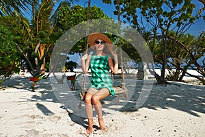 Woman in green dress at beach