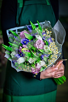 Woman in Green Dress With Bouquet of Flowers