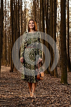 woman in green dress on nature fashion photo