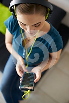 Woman With Green Earphones Listens Podcast Music On Phone