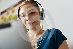 Woman With Green Earphones Listens Podcast Music On Tablet