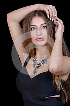 Woman with green eye contact lens , long hair and big necklace