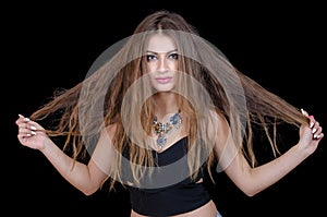 Woman with green eye contact lens and long wavy hair