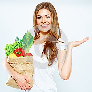 Woman with green food show empty hand.