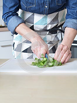 Woman in green kitchen