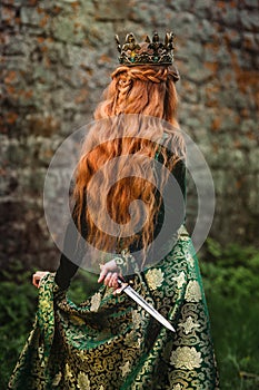 Woman in green medieval dress