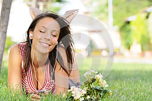 Woman in green park, music and relax