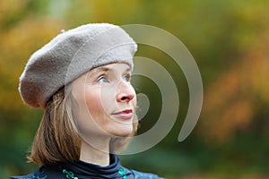 Woman in grey beret