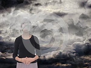 Woman with grey clouds. Depression,sadness concept.