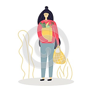 Woman with grocery, shopping bag with food in her hands.