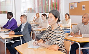 Woman in group of students in university audience