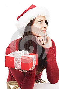 Woman guessing the contents of her Xmas gift photo
