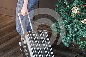 Woman guest at the reception of hotel checking in