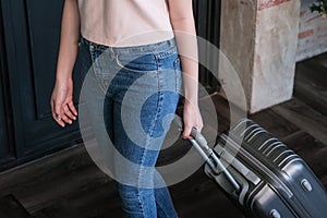 Woman guest at the reception of  hotel checking in