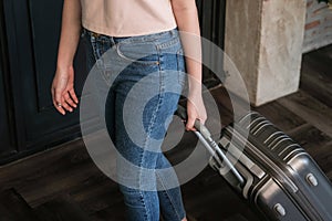 Woman guest at the reception of  hotel checking in