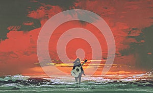 Woman with guitar on back standing in the sea at sunset