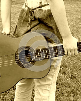 woman guitar behind back