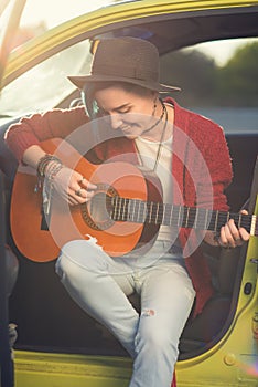 Woman guitarist playing music