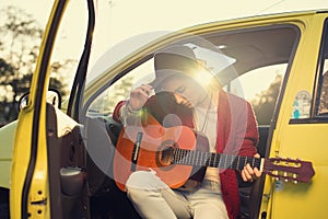 Woman guitarist playing music