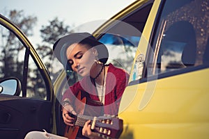 Woman guitarist playing music