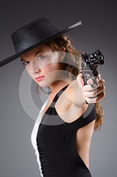 Woman with gun against