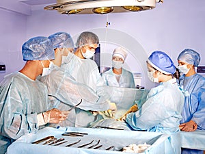 Woman on gurney in operating room.