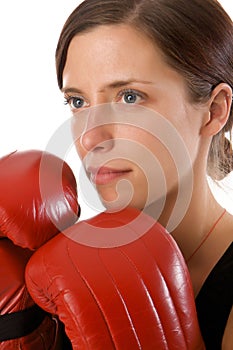 Woman in gym clothes, with boxing gloves, strength