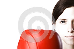 Woman in gym clothes, with boxing gloves, strength