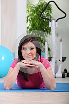 Woman on a gym mat