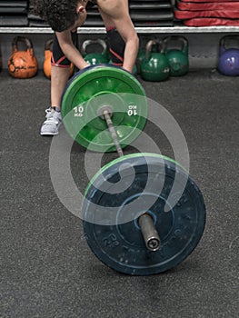 Woman in the gym prepared to train weight training exercises