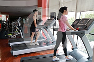 Woman in gym running on a treadmill