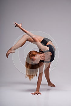 Woman gymnast stretching photo