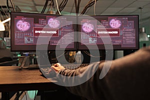 Woman hacking password, coding virus program, typing on keyboard