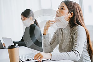 The woman had to remove the mask to breathe after having to wear it for a long time