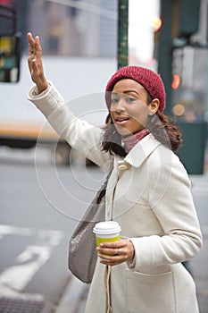 Woman Hailing A Cab