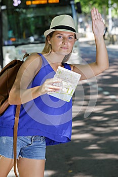 Woman hailing for taxi