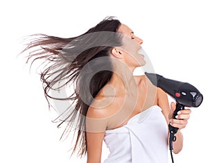 Woman, hair and blow dryer in studio for beauty treatment on white background or salon product, wellness or routine