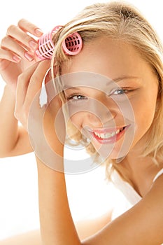 Woman with hair curler