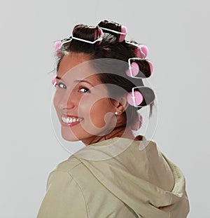 Woman with hair curlers