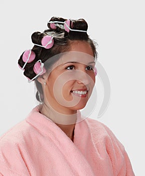 Woman with hair curlers