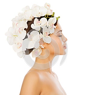 Woman Hair Flower Treatment. Beauty Model in Orchid Floral Crown Hairstyle Profile Side view over isolated White Background