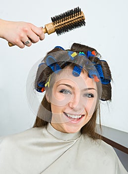 Woman with hair rollers