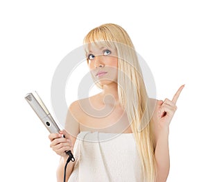 Woman with hair straighteners
