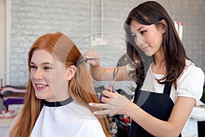 Woman hairdresser in beauty salon cut hair and hair design